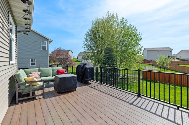214 15th Ave SE, Lonsdale, MN 55046 - wooden deck with an outdoor hangout area, area for grilling, a lawn, and a residential view