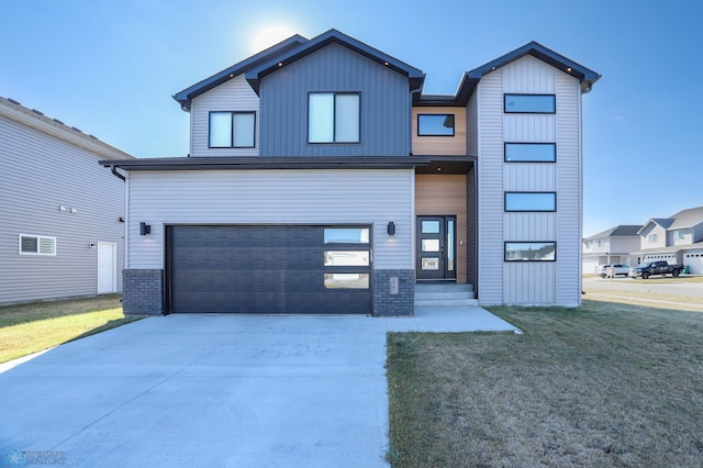 view of front facade with a front yard and a garage