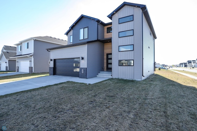 view of front of house featuring a front lawn and a garage