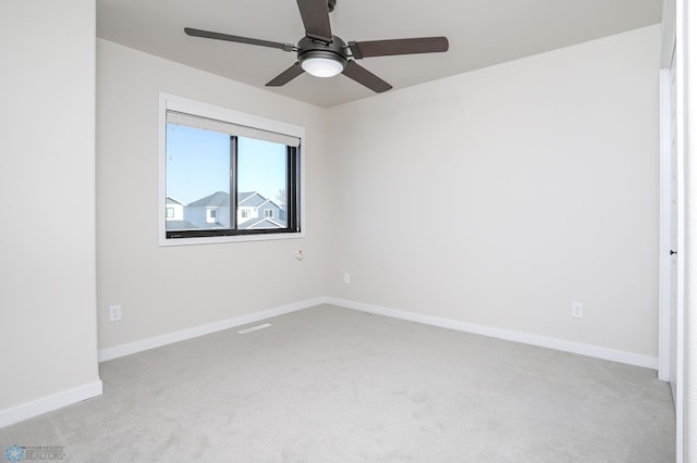 carpeted empty room with ceiling fan