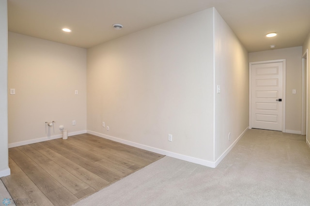 unfurnished room with light wood-type flooring