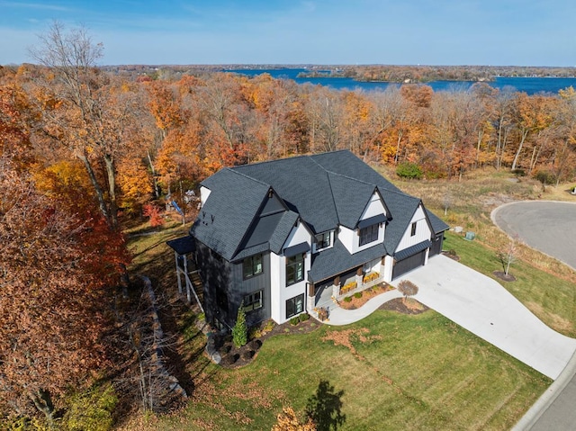 birds eye view of property with a water view