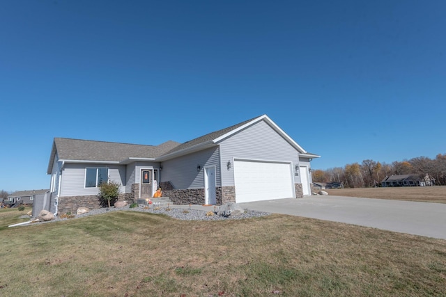 single story home featuring a front lawn and a garage