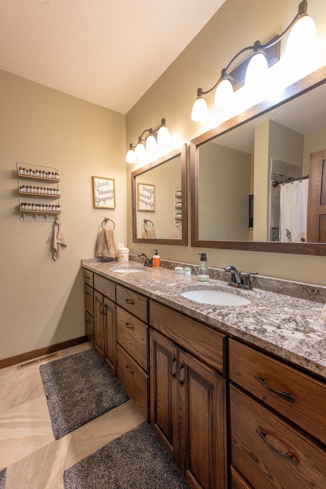 bathroom featuring vanity and tile patterned flooring