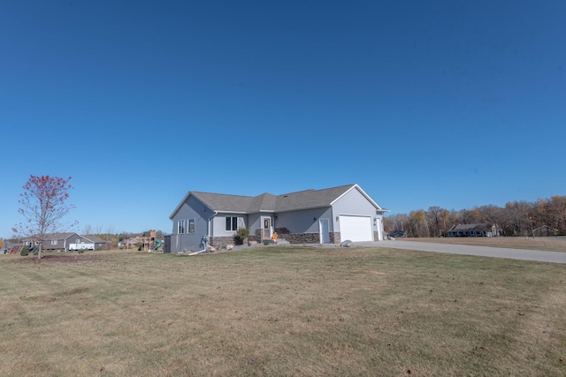 single story home featuring a front yard and a garage