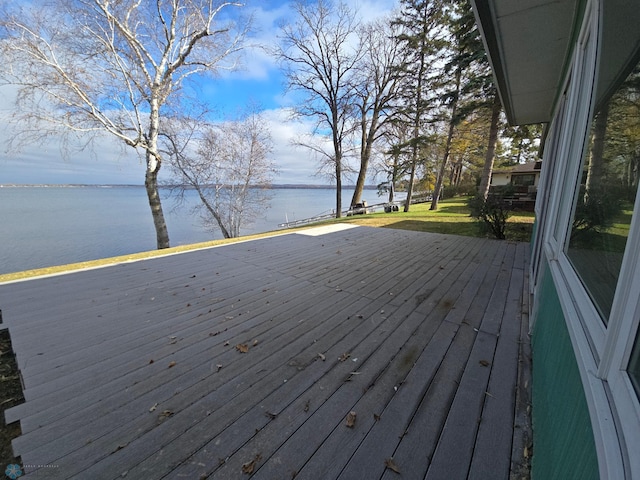 wooden terrace with a water view