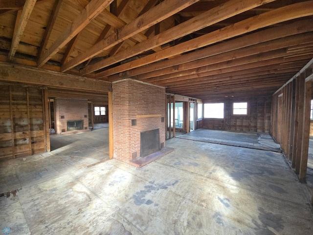 miscellaneous room with a brick fireplace