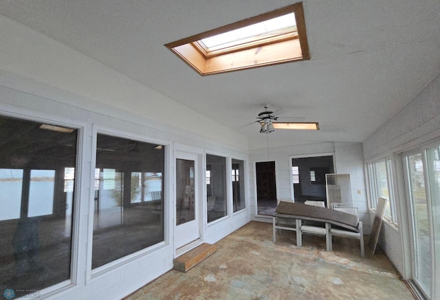 sunroom with vaulted ceiling with skylight and ceiling fan