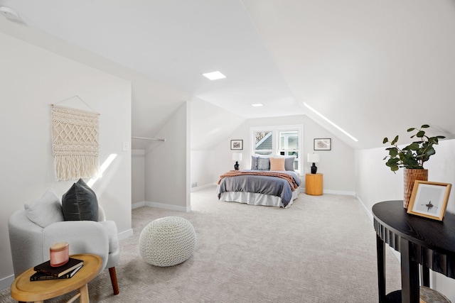 bedroom featuring lofted ceiling and light colored carpet