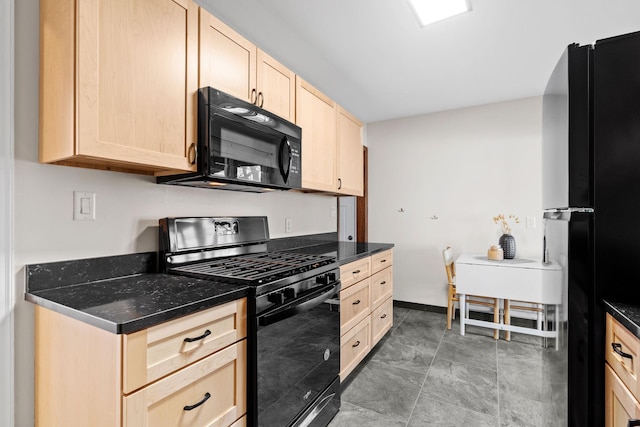 kitchen featuring light brown cabinetry and black appliances