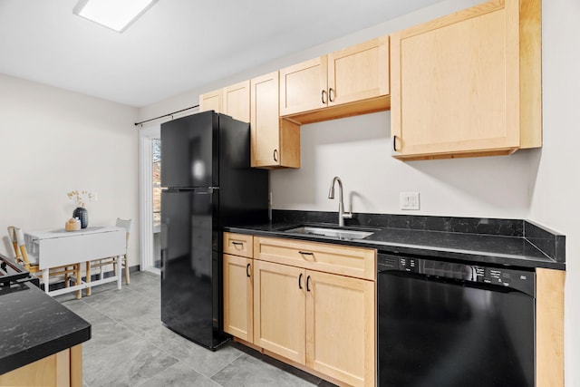 kitchen featuring sink, black appliances, dark stone counters, and light brown cabinets