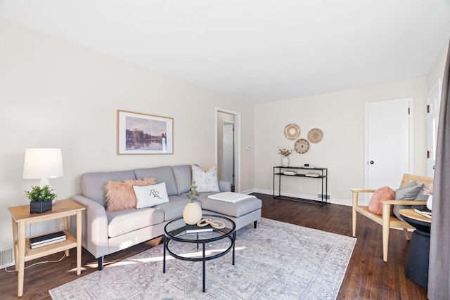 living room with dark hardwood / wood-style flooring