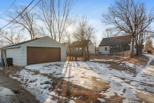 exterior space featuring a garage and an outdoor structure