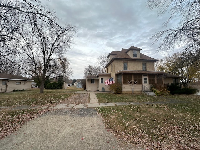 view of front of house with a front lawn and a porch