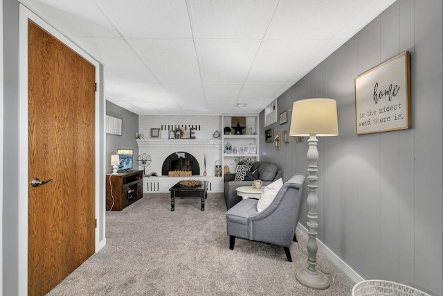 interior space featuring carpet floors and a brick fireplace