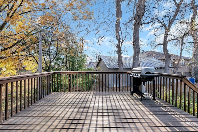 wooden deck featuring area for grilling