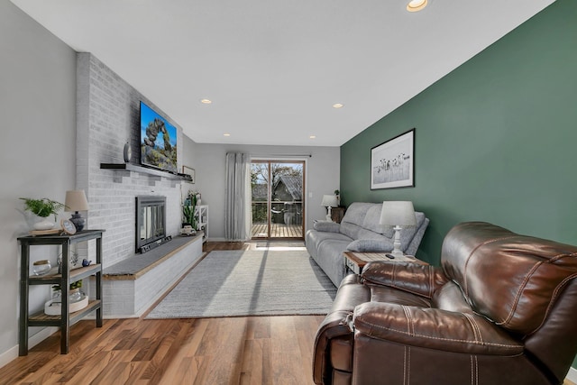 living room featuring a fireplace and hardwood / wood-style flooring