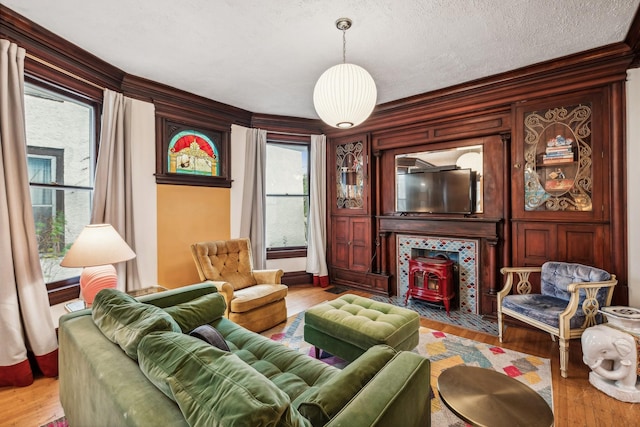 2742 Dupont Ave S, Minneapolis, MN 55408 - living area featuring wood finished floors, ornamental molding, and a textured ceiling