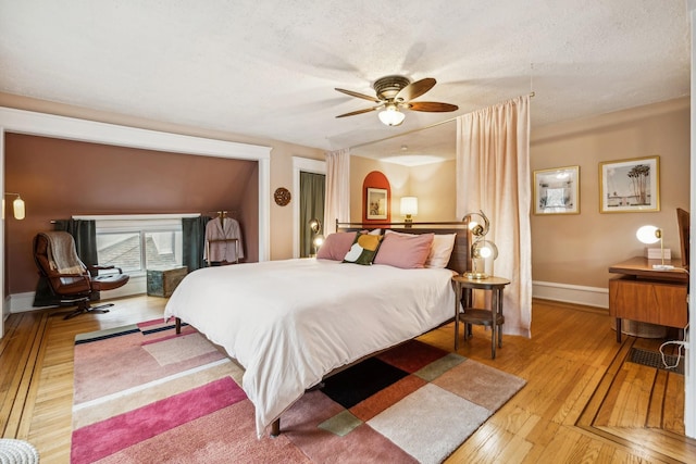 2742 Dupont Ave S, Minneapolis, MN 55408 - bedroom with hardwood / wood-style flooring and ceiling fan