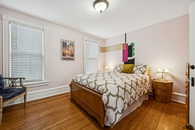 2742 Dupont Ave S, Minneapolis, MN 55408 - bedroom featuring baseboards and wood finished floors