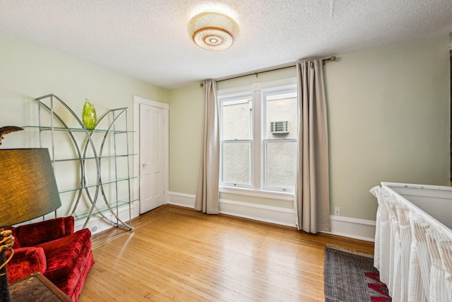 2742 Dupont Ave S, Minneapolis, MN 55408 - bedroom with a textured ceiling and wood finished floors