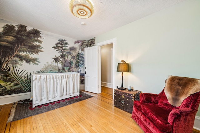 2742 Dupont Ave S, Minneapolis, MN 55408 - sitting room with wood-type flooring and a textured ceiling