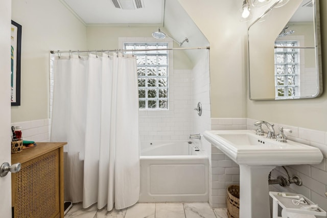2742 Dupont Ave S, Minneapolis, MN 55408 - full bath featuring tile walls, shower / bath combo with shower curtain, and wainscoting