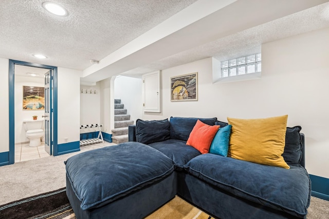 2742 Dupont Ave S, Minneapolis, MN 55408 - living room featuring a textured ceiling, light colored carpet, stairs, light tile patterned floors, and recessed lighting