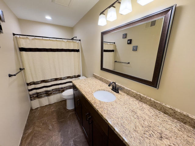 bathroom featuring vanity, toilet, and a shower with shower curtain