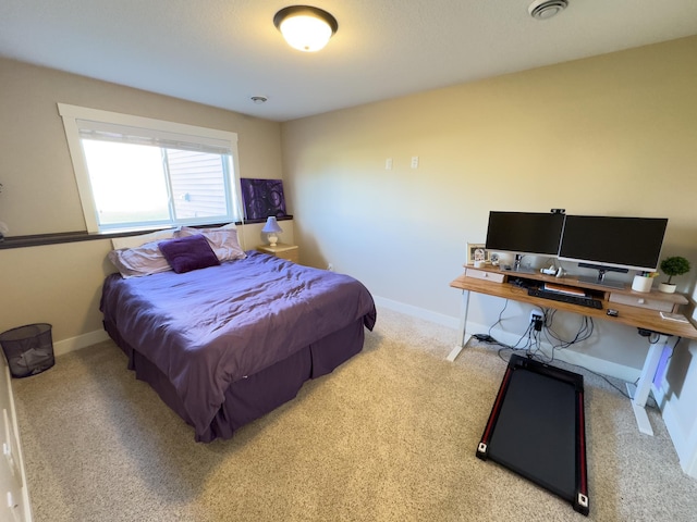 bedroom featuring light carpet