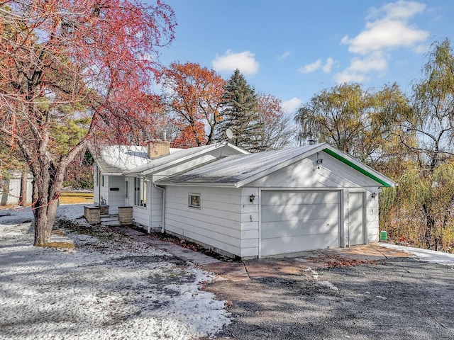 view of side of home with a garage