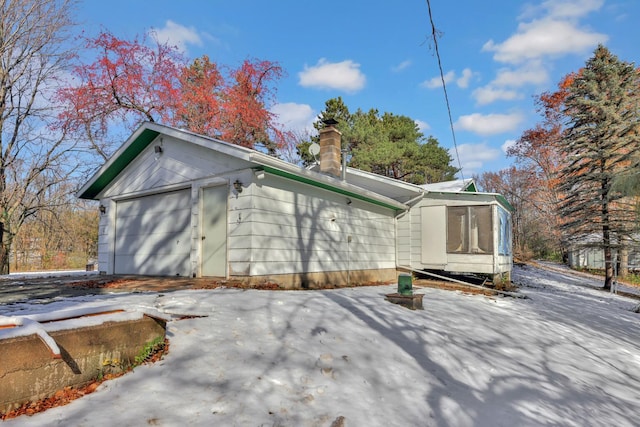 view of property exterior featuring a garage