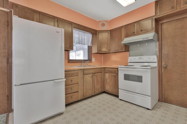 kitchen with sink and white appliances