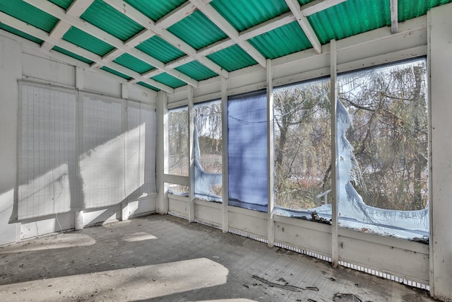 unfurnished sunroom with vaulted ceiling