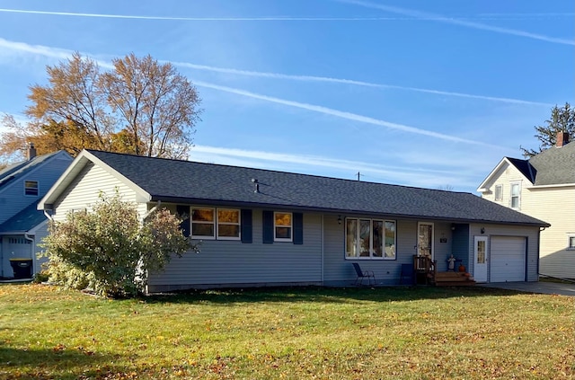 single story home with a front yard and a garage