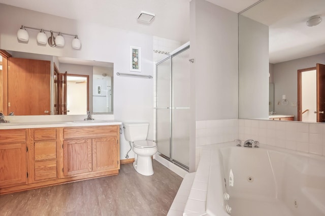 full bathroom featuring vanity, toilet, independent shower and bath, and hardwood / wood-style floors