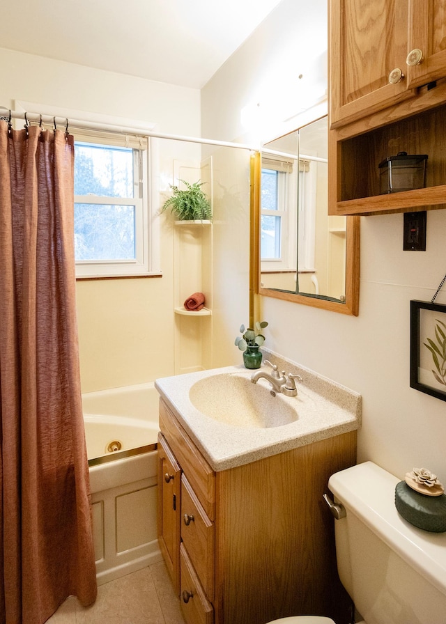 full bathroom with tile patterned floors, shower / washtub combination, vanity, and toilet