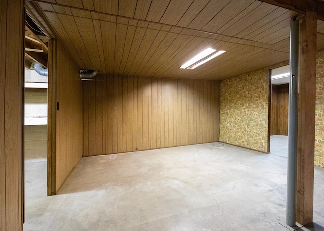 empty room with wood walls and wood ceiling