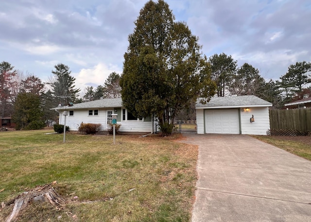 single story home featuring a garage and a front yard