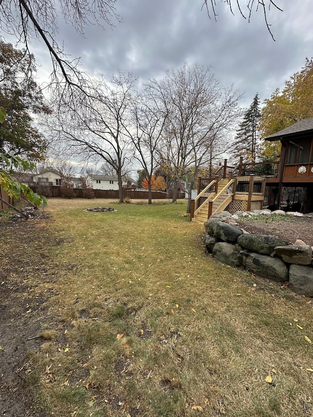 view of yard featuring a wooden deck