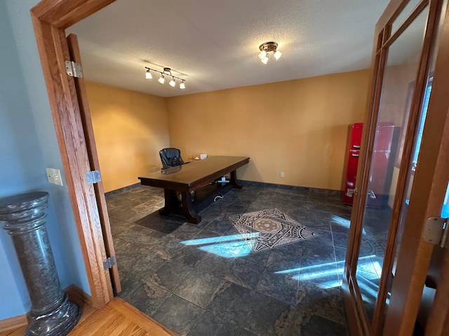 office area featuring a textured ceiling