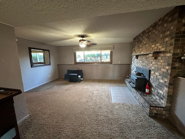 unfurnished living room with carpet flooring, a textured ceiling, and ceiling fan