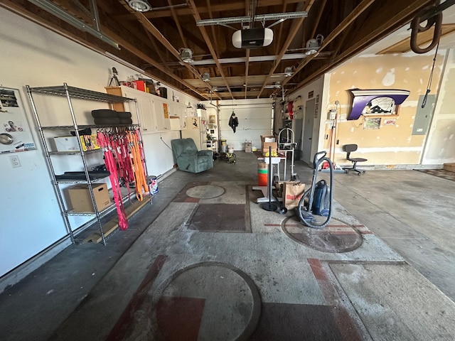 interior space featuring electric panel and a garage door opener