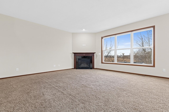 unfurnished living room with carpet flooring