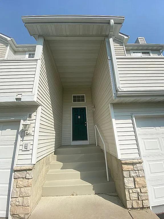 property entrance featuring a garage