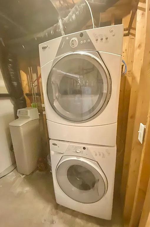 washroom with stacked washer and clothes dryer