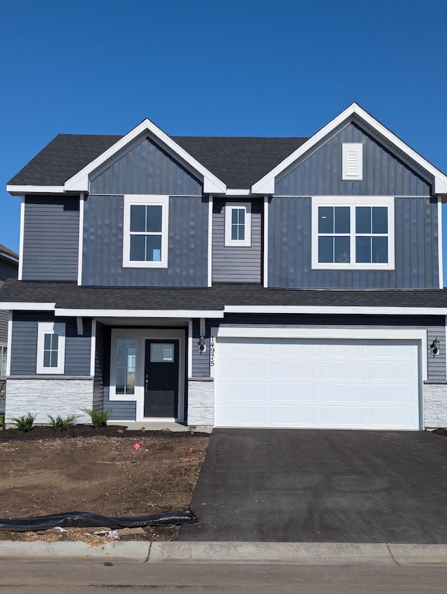 view of front of property featuring a garage