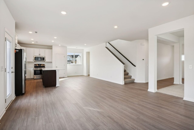 unfurnished living room with hardwood / wood-style flooring