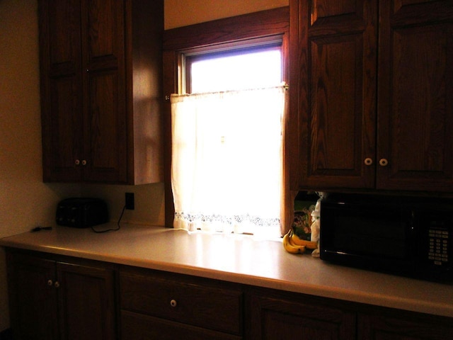 kitchen with dark brown cabinetry