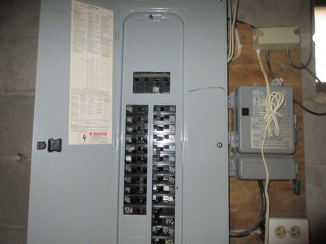 utility room featuring electric panel